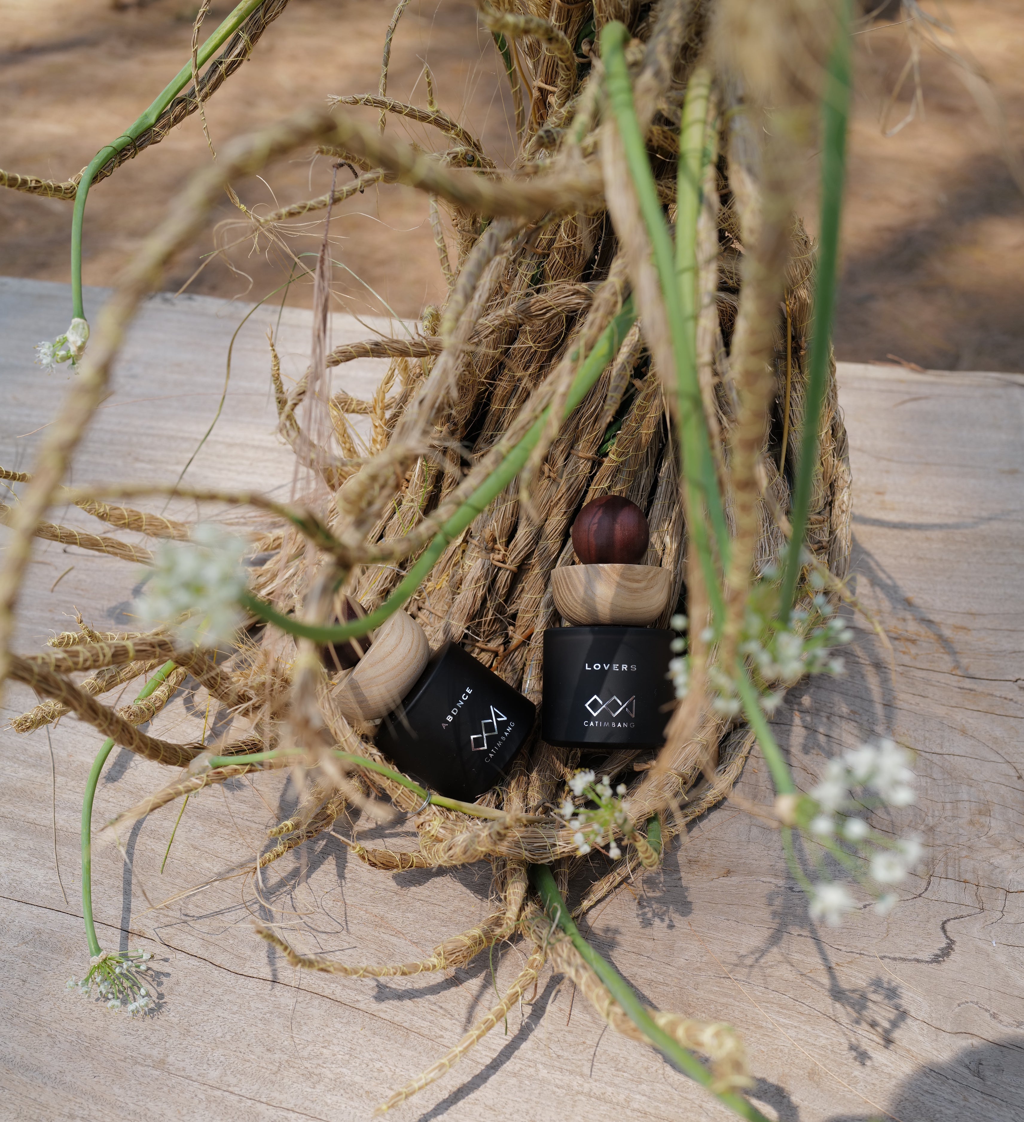 Lifestyle image of two CCJ Parfum luxury perfume scents styled elegantly, showcasing premium fragrance bottles in a refined setting.